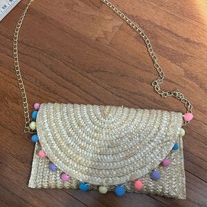 Straw envelope clutch/gold chain crossbody with snap closure/pom pom detail NWOT